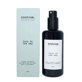 Routine Lucy in the Sky Natural Mist - front view of black glass bottle with pump dispenser and clean white label